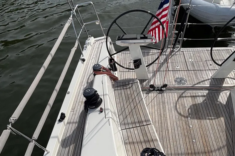 Katara Yacht Photos Pics 2023 X-Yachts X4³ MkII sailboat deck with dual steering wheels and American flag.