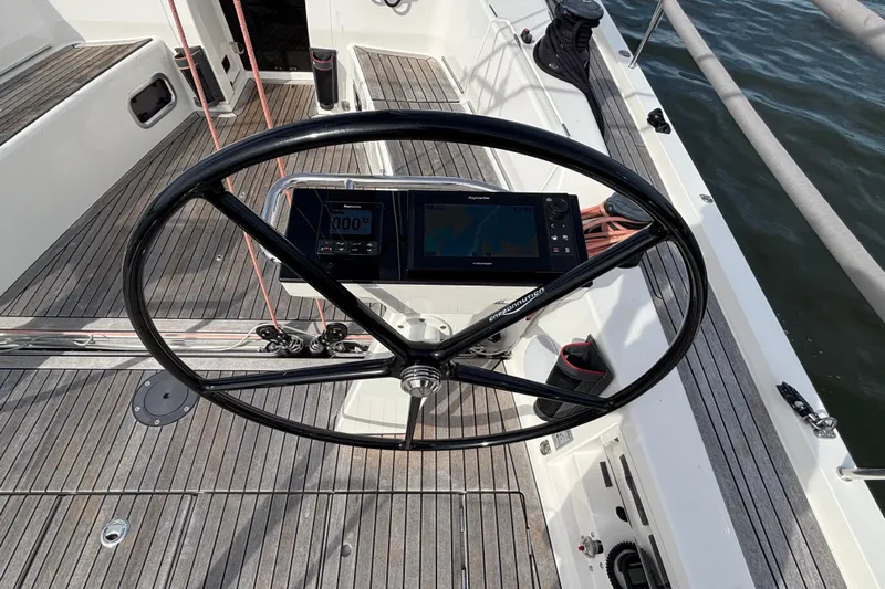 Katara Yacht Photos Pics Steering wheel and navigation system on 2023 X-Yachts X4³ MkII sailboat deck.