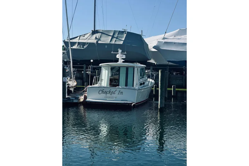 2021 Back Cove 37 Yacht Photos Pics 2021 Back Cove 37 boat docked in marina, named "Checked In," Greenport, NY.
