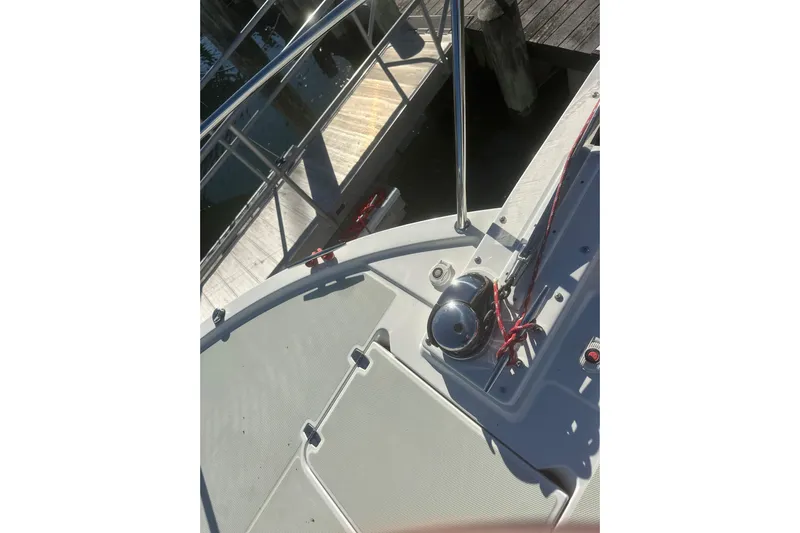 2021 Back Cove 37 Yacht Photos Pics Bow of 2021 Back Cove 37 yacht with dock view and railing.
