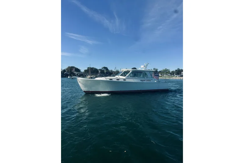 2021 Back Cove 37 Yacht Photos Pics 2021 Back Cove 37 boat cruising on a sunny day, with clear blue skies.