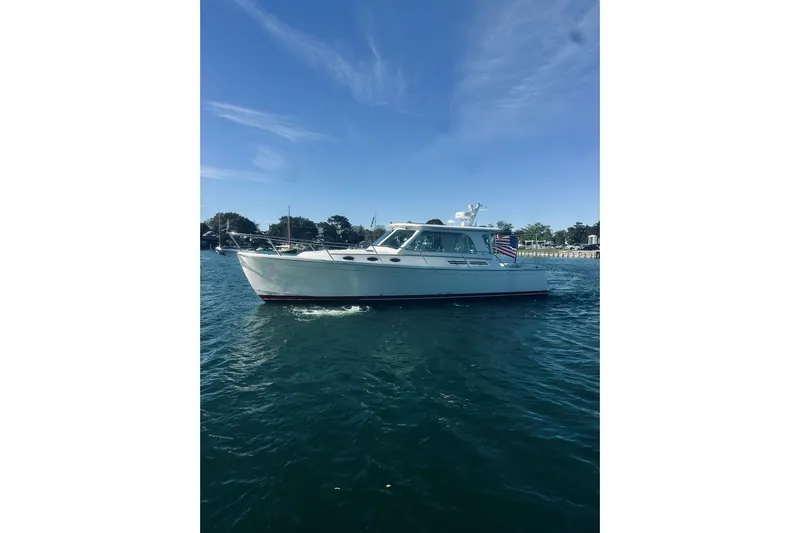 2021 Back Cove 37 Yacht Photos Pics 2021 Back Cove 37 boat cruising on calm waters under a clear blue sky.