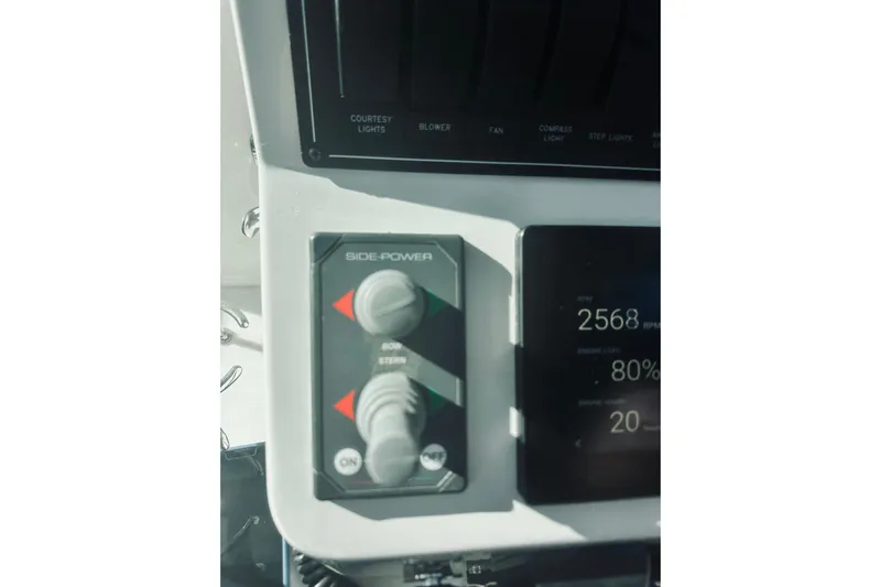 2021 Back Cove 37 Yacht Photos Pics Control panel of a 2021 Back Cove 37 boat, featuring Side-Power controls and digital display.