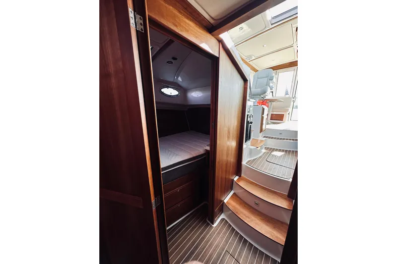 2021 Back Cove 37 Yacht Photos Pics Interior of 2021 Back Cove 37 yacht, featuring wooden cabin and stairs.