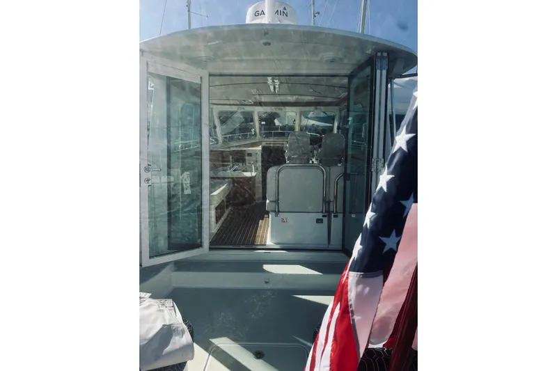 2021 Back Cove 37 Yacht Photos Pics 2021 Back Cove 37 yacht interior with American flag, showcasing modern design and navigation equipment.