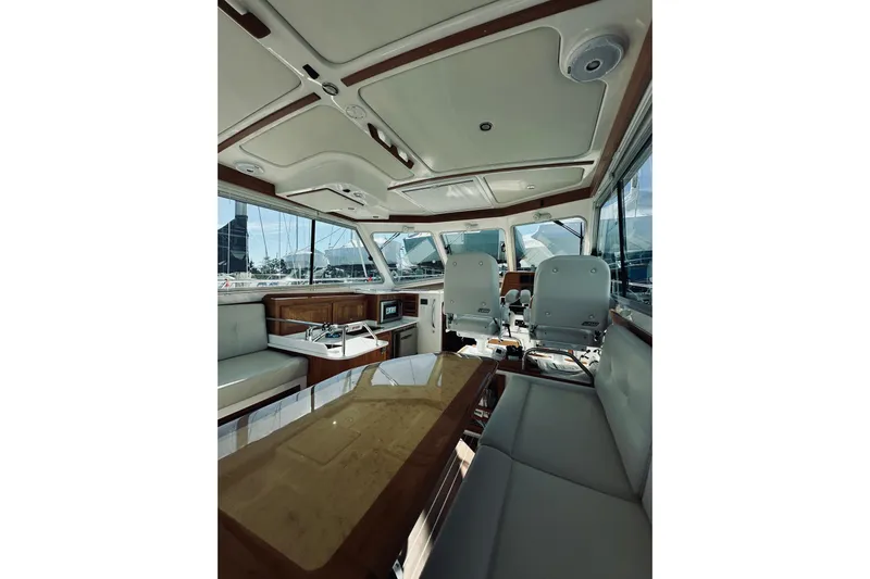 2021 Back Cove 37 Yacht Photos Pics Interior of 2021 Back Cove 37 yacht, featuring seating and helm area.