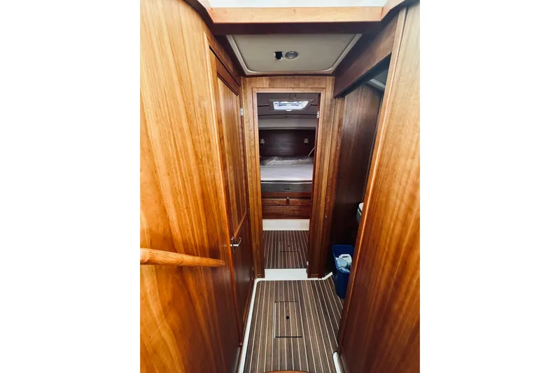 2021 Back Cove 37 Yacht Photos Pics Interior of 2021 Back Cove 37 yacht, featuring wooden paneling and cozy cabin space.