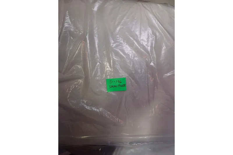 2021 Back Cove 37 Yacht Photos Pics Plastic-wrapped item labeled "D-196 Salon Pillow" for Back Cove 37, 2021 model.