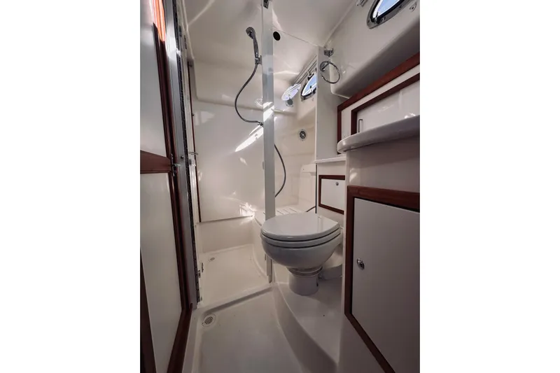 2021 Back Cove 37 Yacht Photos Pics 2021 Back Cove 37 yacht bathroom with shower, toilet, and storage cabinets.