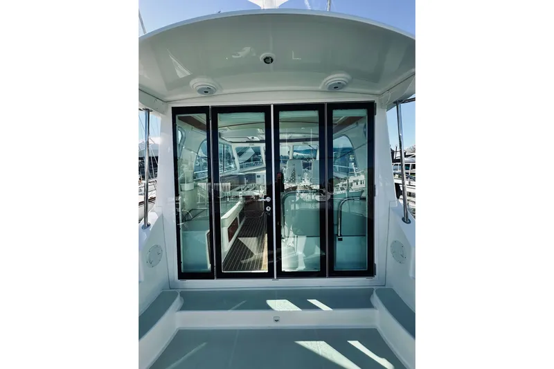 2021 Back Cove 37 Yacht Photos Pics 2021 Back Cove 37 boat with glass doors and spacious interior view.