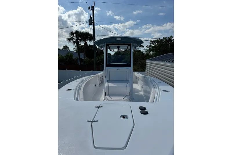  Yacht Photos Pics 2025 Sea Hunt Gamefish 27 Coffin Box boat, sleek design under a partly cloudy sky.