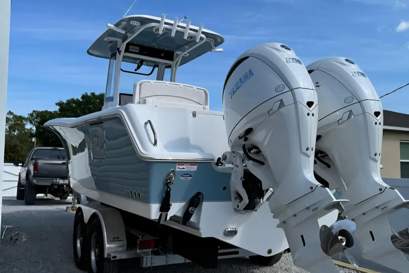  Yacht Photos Pics 2025 Sea Hunt Gamefish 27 Coffin Box boat with dual Yamaha engines on trailer.