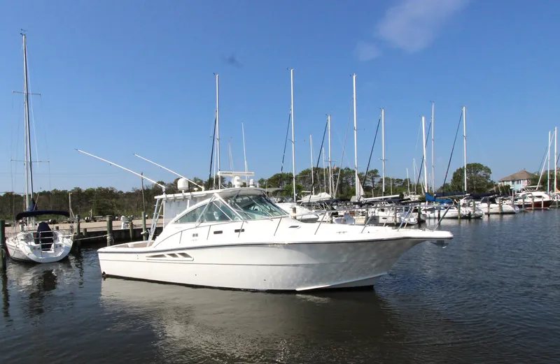 Duke Yacht Photos Pics 2005 Rampage 35 Express boat docked in a marina under clear blue skies.
