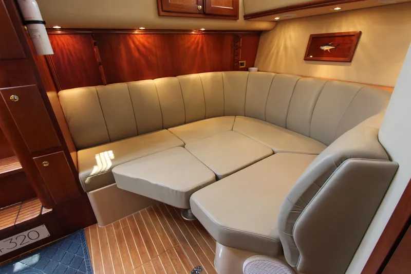 Duke Yacht Photos Pics Luxurious interior of 2005 Rampage 35 Express yacht with beige seating and wooden accents.