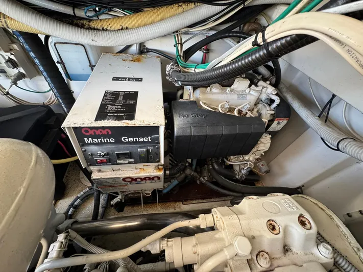 Duke Yacht Photos Pics Onan Marine Genset in 2005 Rampage 35 Express engine room, surrounded by cables and components.