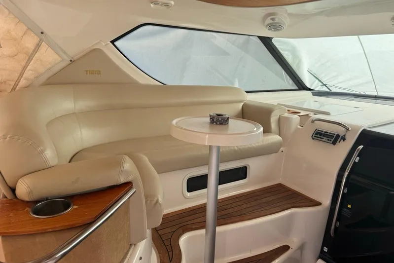  Yacht Photos Pics Luxurious interior of 2008 Tiara Sovran 43 yacht with beige seating and wooden accents.
