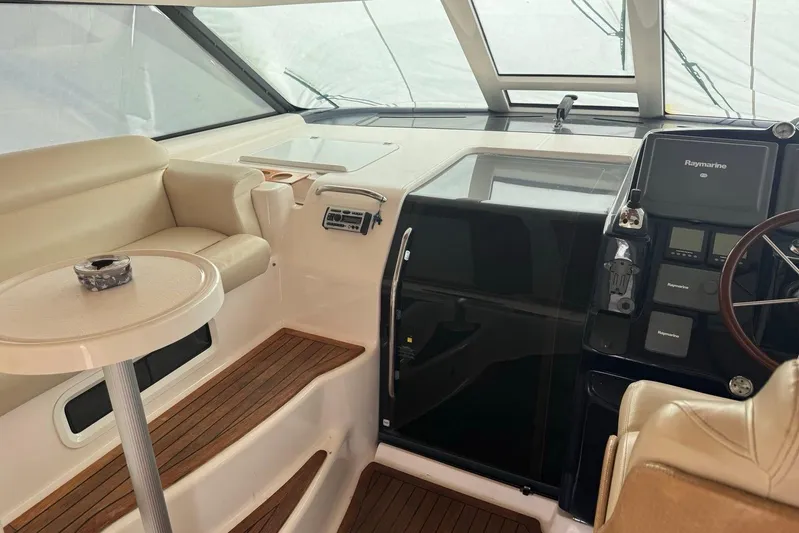  Yacht Photos Pics Interior of 2008 Tiara Sovran 43 yacht with helm and seating area.