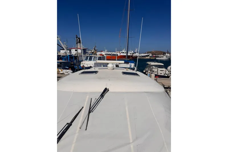  Yacht Photos Pics 2008 Tiara Sovran 43 yacht docked at a busy marina under clear blue skies.