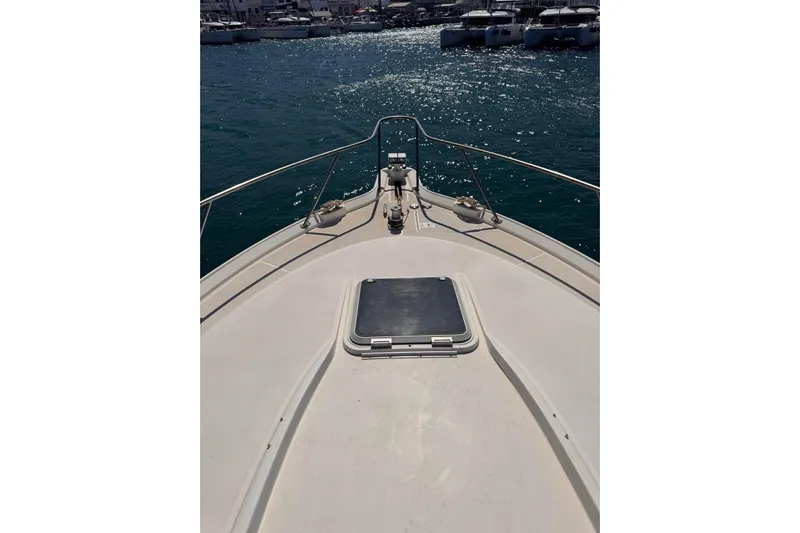  Yacht Photos Pics Bow view of 2008 Tiara Sovran 43 yacht on sparkling water.