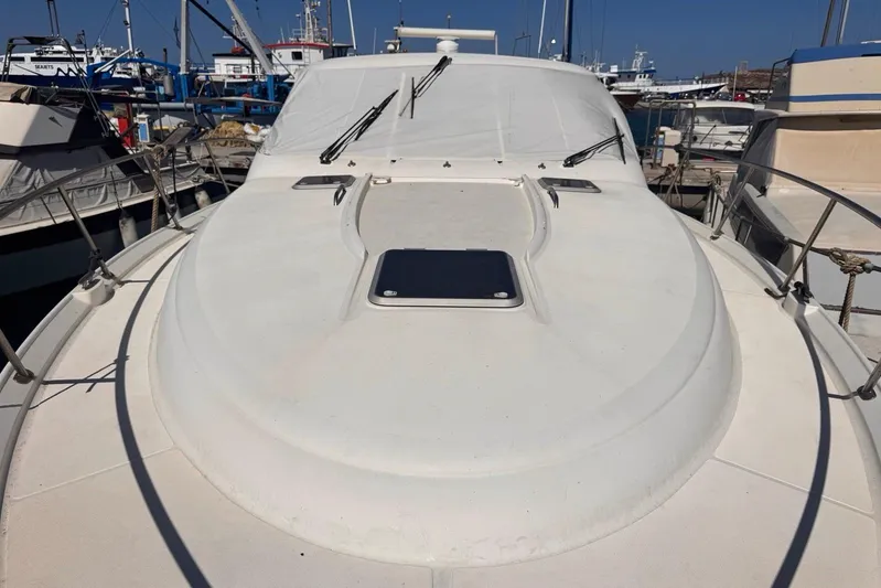  Yacht Photos Pics 2008 Tiara Sovran 43 yacht docked at marina, showcasing sleek deck design.