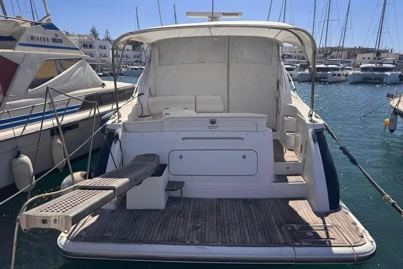  Yacht Photos Pics 2008 Tiara Sovran 43 yacht docked in marina, rear view with open deck.