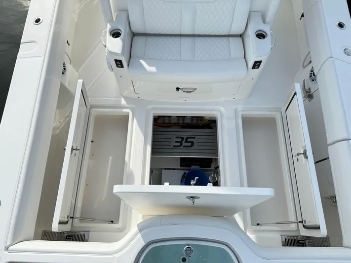 Storm Gray Yacht Photos Pics 2025 Regulator 35 boat interior with storage compartments and seating.