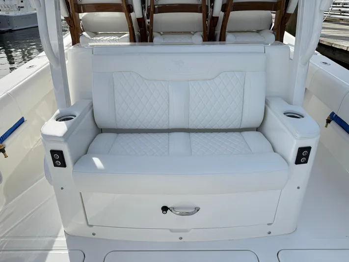 Storm Gray Yacht Photos Pics White leather seating on 2025 Regulator 35 boat, featuring cup holders and quilted design.