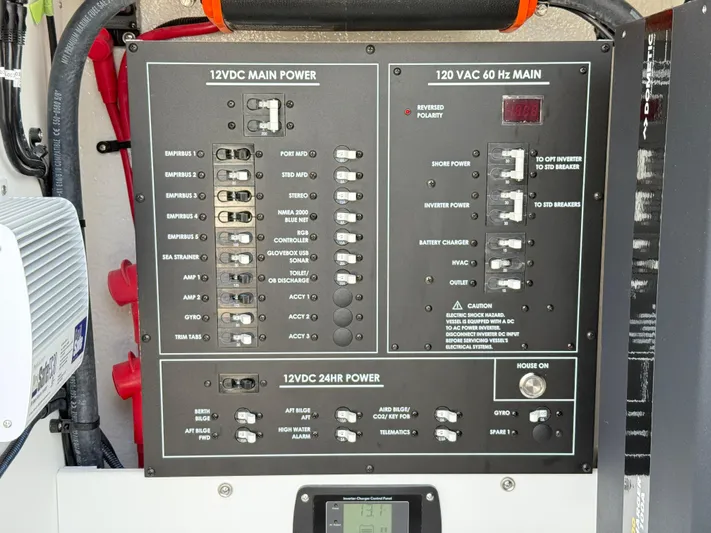 Storm Gray Yacht Photos Pics Electrical panel on 2025 Regulator 35 boat, featuring 12VDC and 120VAC power controls.