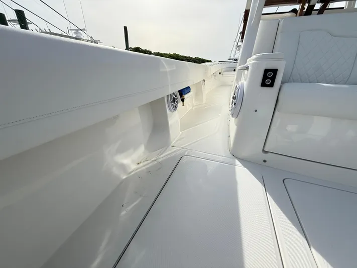 Storm Gray Yacht Photos Pics 2025 Regulator 35 boat interior with white seating and sleek design.