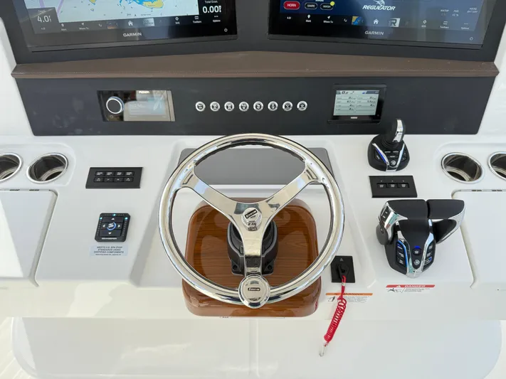 Storm Gray Yacht Photos Pics 2025 Regulator 35 boat helm with advanced controls and navigation displays.