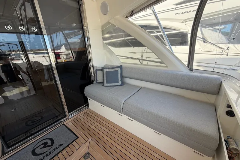  Yacht Photos Pics 2021 Riviera 50 Sports Motor Yacht interior with sleek seating and modern design.