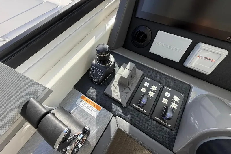  Yacht Photos Pics Control panel of 2021 Riviera 50 Sports Motor Yacht with joystick and engine controls.