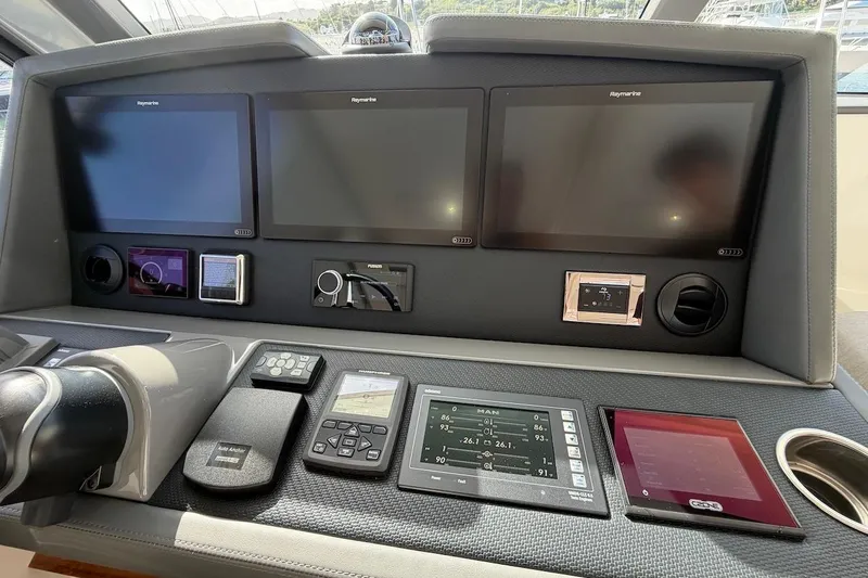  Yacht Photos Pics Control panel of 2021 Riviera 50 Sports Motor Yacht with multiple screens and navigation equipment.