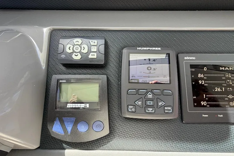  Yacht Photos Pics Control panel of a 2021 Riviera 50 Sports Motor Yacht with various electronic displays.