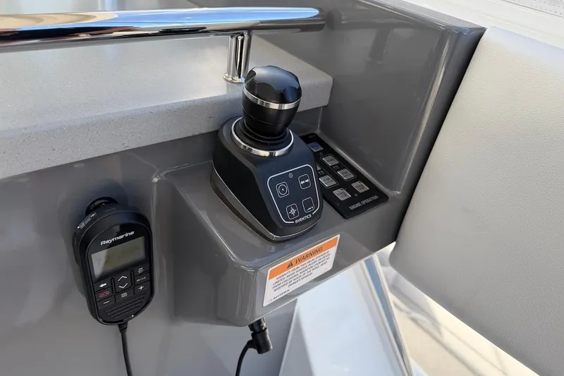  Yacht Photos Pics Control panel of 2021 Riviera 50 Sports Motor Yacht with joystick and Raymarine device.