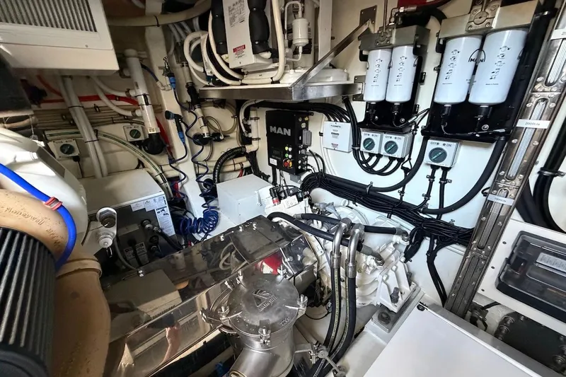  Yacht Photos Pics Engine room of 2021 Riviera 50 Sports Motor Yacht with complex machinery and wiring.