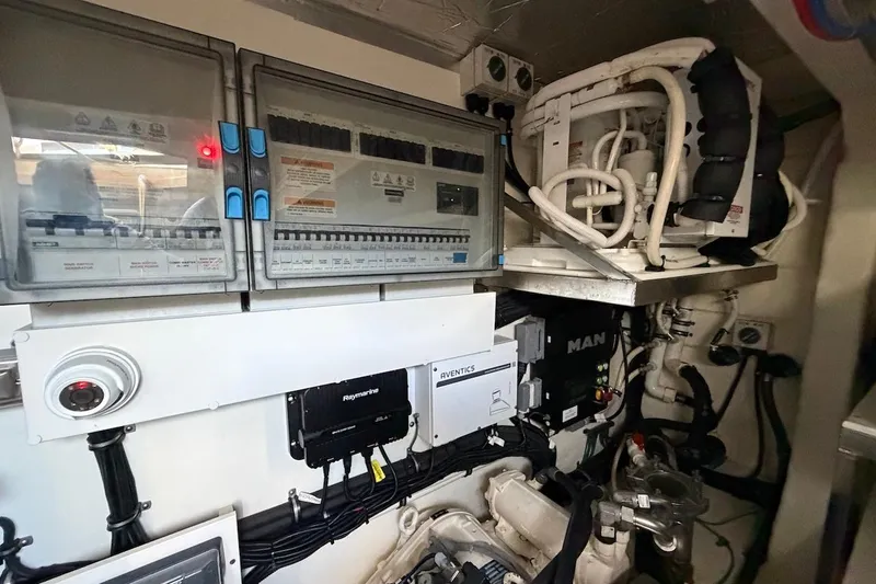  Yacht Photos Pics Engine room of 2021 Riviera 50 Sports Motor Yacht with control panels and machinery.