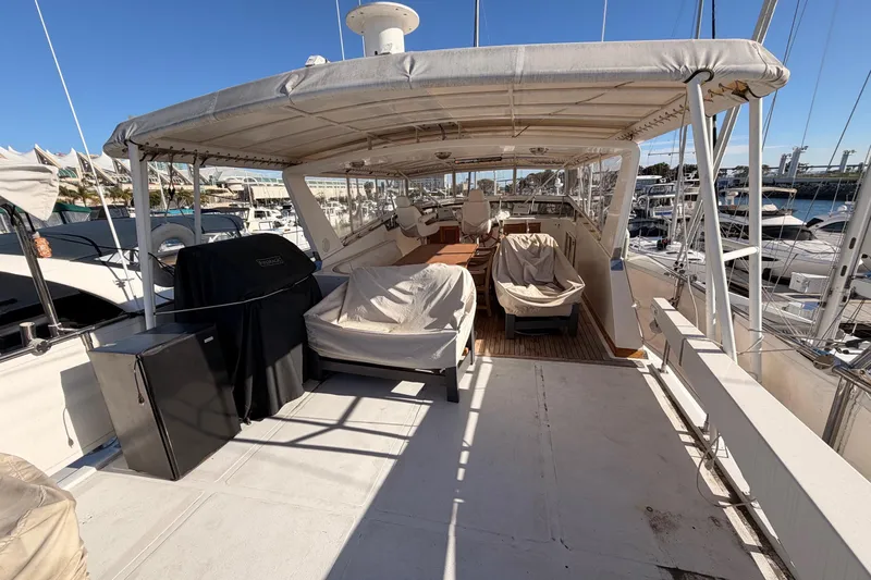 All The Way Yacht Photos Pics 1984 Hartman-Palmer 60 Flush Deck Motor Yacht, spacious deck with covered seating area.