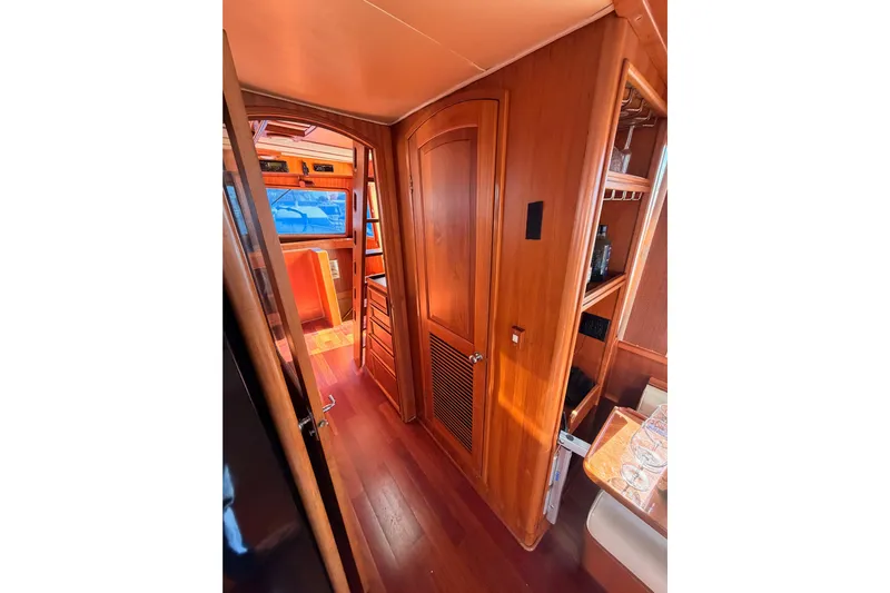 All The Way Yacht Photos Pics Interior of 1984 Hartman-Palmer 60 Flush Deck Motor Yacht with wooden finishes.