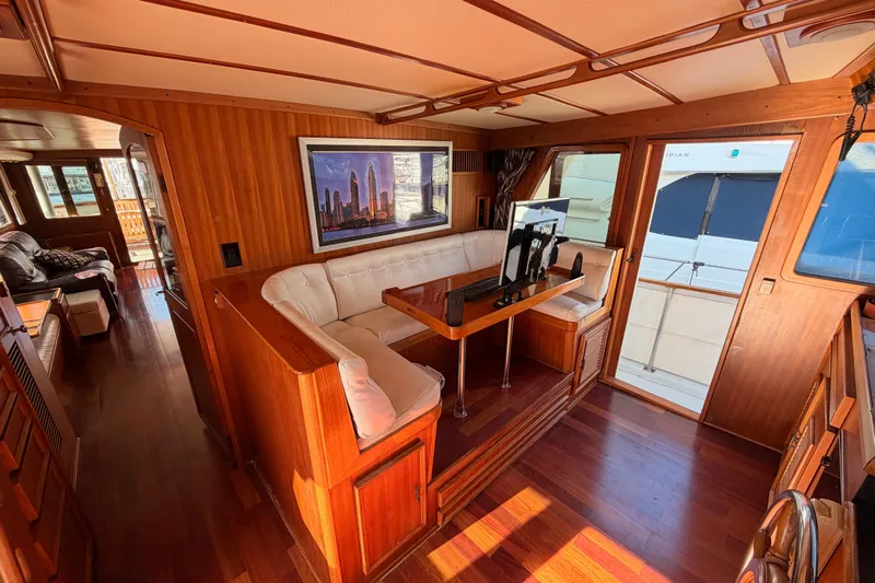 All The Way Yacht Photos Pics Luxurious 1984 Hartman-Palmer 60 Flush Deck Motor Yacht interior with elegant wood finish.