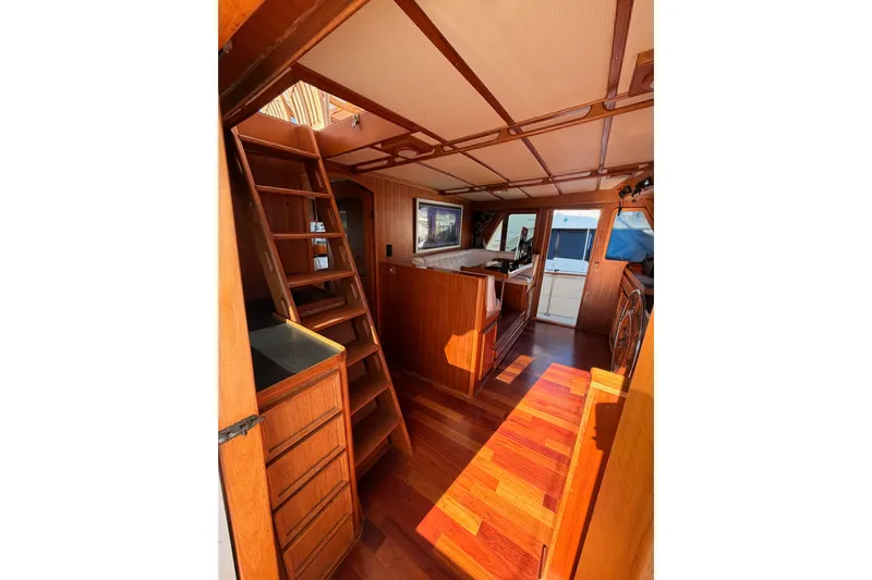 All The Way Yacht Photos Pics Interior of 1984 Hartman-Palmer 60 Flush Deck Motor Yacht with wooden finishes.