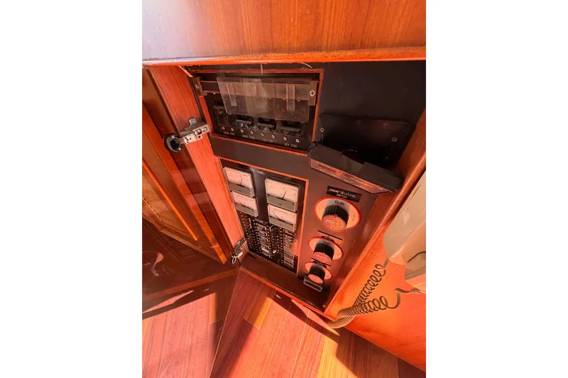 All The Way Yacht Photos Pics Control panel inside 1984 Hartman-Palmer 60 Flush Deck Motor Yacht, featuring switches and gauges.