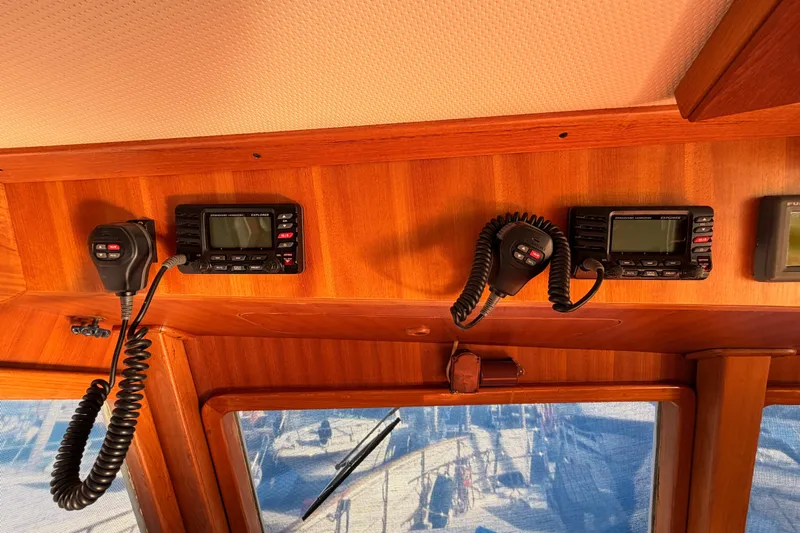 All The Way Yacht Photos Pics Interior of 1984 Hartman-Palmer yacht with communication radios and wooden paneling.