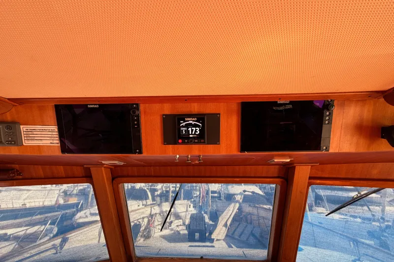 All The Way Yacht Photos Pics Interior helm of 1984 Hartman-Palmer 60 Flush Deck Motor Yacht with navigation equipment.