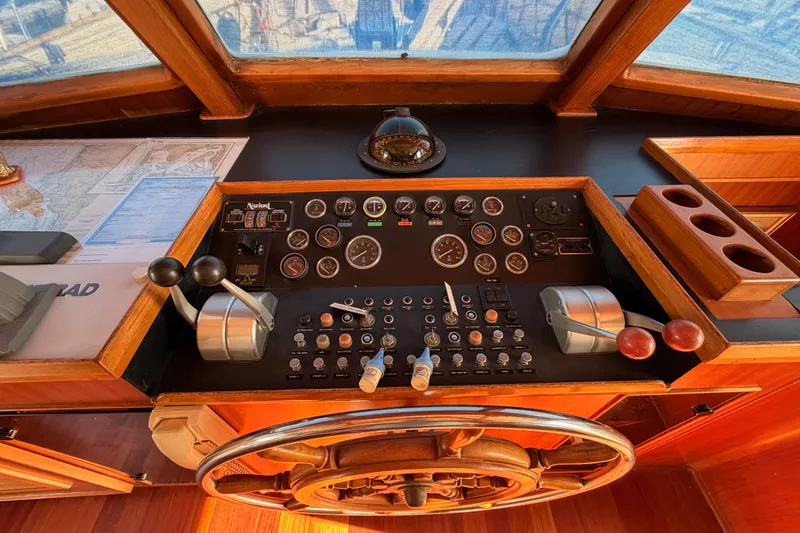 All The Way Yacht Photos Pics Control panel of 1984 Hartman-Palmer 60 Flush Deck Motor Yacht with navigation instruments.