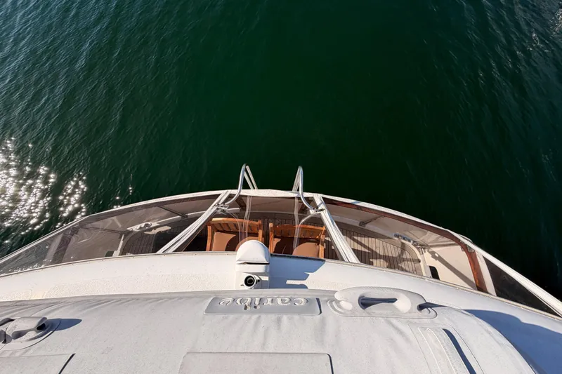 All The Way Yacht Photos Pics Aerial view of 1984 Hartman-Palmer 60 Flush Deck Motor Yacht on calm water.