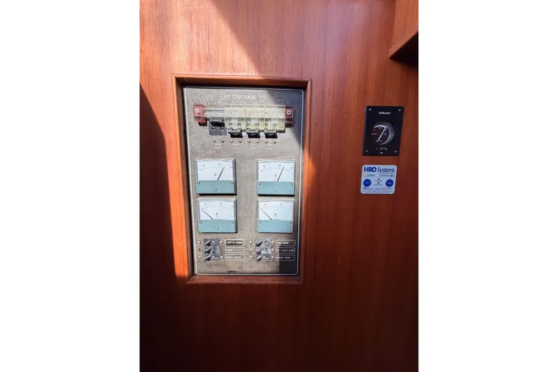 All The Way Yacht Photos Pics Control panel on 1984 Hartman-Palmer 60 Flush Deck Motor Yacht, featuring gauges and switches.