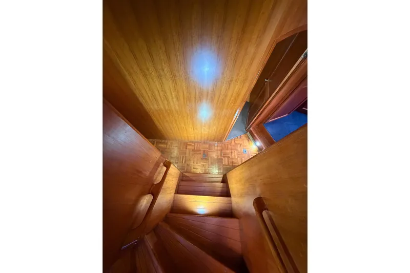 All The Way Yacht Photos Pics Wooden staircase inside 1984 Hartman-Palmer 60 Flush Deck Motor Yacht.