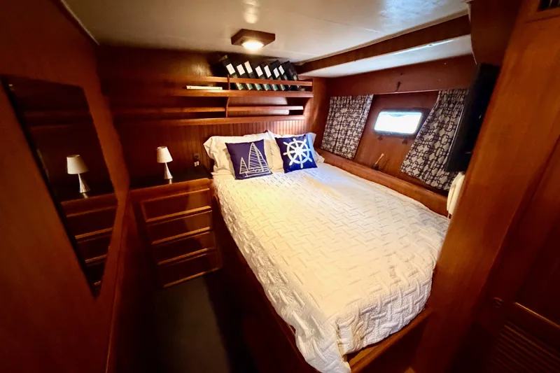 All The Way Yacht Photos Pics Cozy bedroom in 1984 Hartman-Palmer 60 Flush Deck Motor Yacht with nautical decor.