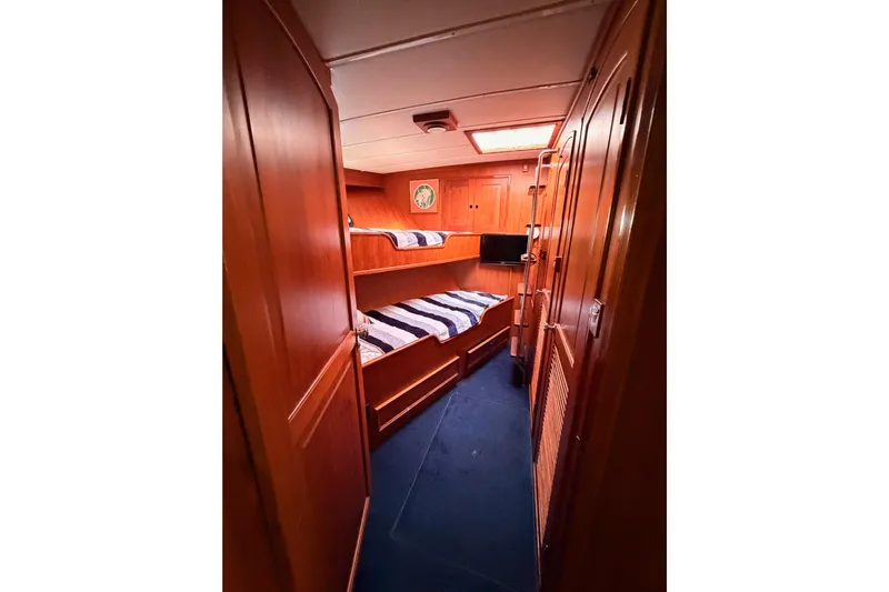 All The Way Yacht Photos Pics 1984 Hartman-Palmer 60 Flush Deck Motor Yacht cabin with wooden interior and bunk beds.
